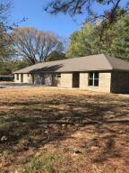 Duplex that features two bedrooms, two baths, large kitchen and dining area, large garage and concrete patio.