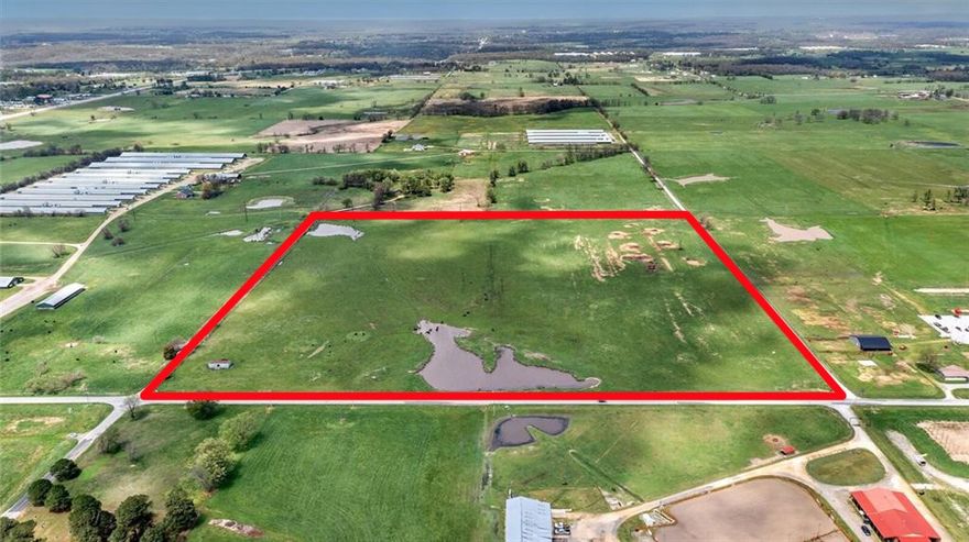 Endless possibilities with this blank canvas!  40+/- acres in booming area of NW Arkansas.  Located at Airport Road/Bill Young Road right outside of town.  Just 1/2 mile off AR 59, and 2 miles to HWY 412.  Near the Siloam Springs High School and the new Regional Hospital.  Less than 1 mile to the Airport.  Land is clear, flat, and could easily be developed.  Currently running cattle.  2 ponds on the property and it is fully fenced.  No current utilities on site.  Seller open to dividing!