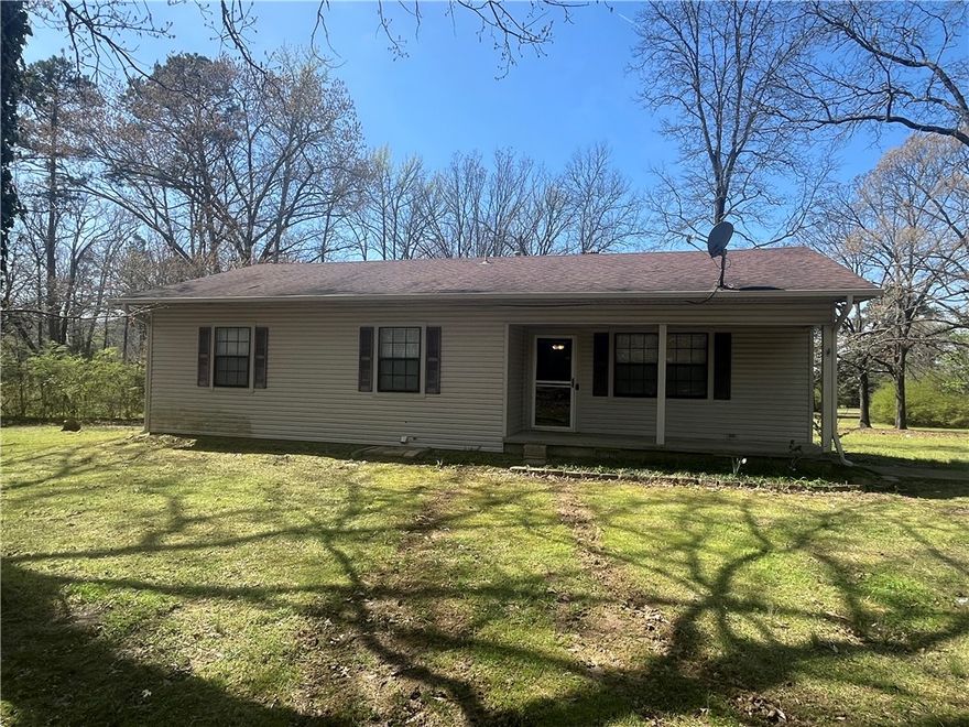 Secluded 3-bedroom home on 3.5 acres in Alexander. This property features a spacious covered porch, a versatile basement ideal for storage or expansion, and plenty of room to enjoy nature and privacy. With mature trees and quiet surroundings, this home offers the perfect blend of comfort and country living—just minutes from town conveniences.