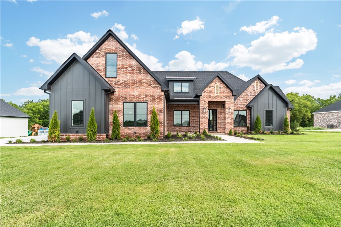 This stunning new construction farmhouse in East Fayetteville offers a perfect blend of contemporary elegance and modern charm. Thoughtfully designed and meticulously built, with 4 spacious bedrooms, 3.5 luxurious bathrooms and a dedicated office - the home is designed for both comfort and functionality. The expansive covered patio provides a serene outdoor space, offering uninterrupted views of the surrounding woods. Just 10 minutes to the shopping & restaurants off Mission and 265 and less than 20 minutes to I49, this home is ideal for a buyer seeking tranquility without sacrificing convenience, a true retreat in a desirable location! Schedule your showing today!