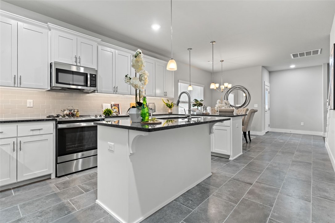 This modern new construction home is a unique find and a must see! Located just off of I-49, this location screams convenience! Builder to pay $5000 towards closing cost plus an additional preferred lender credit towards closing costs. This home offers 3 spacious bedrooms and a large bonus room upstairs. The walkout oversized covered patio is sure to impress with amazing views of the new community. Fully fenced yard makes this home move in ready! Nice neutral color scheme throughout with black granite countertops, white classic cabinetry, and stainless steel appliances. Welcome home to Timber Ridge Subdivision. Great for primary residence or investment portfolio! Be sure to check for Open House schedule. Agent on site most every day for your convenience.