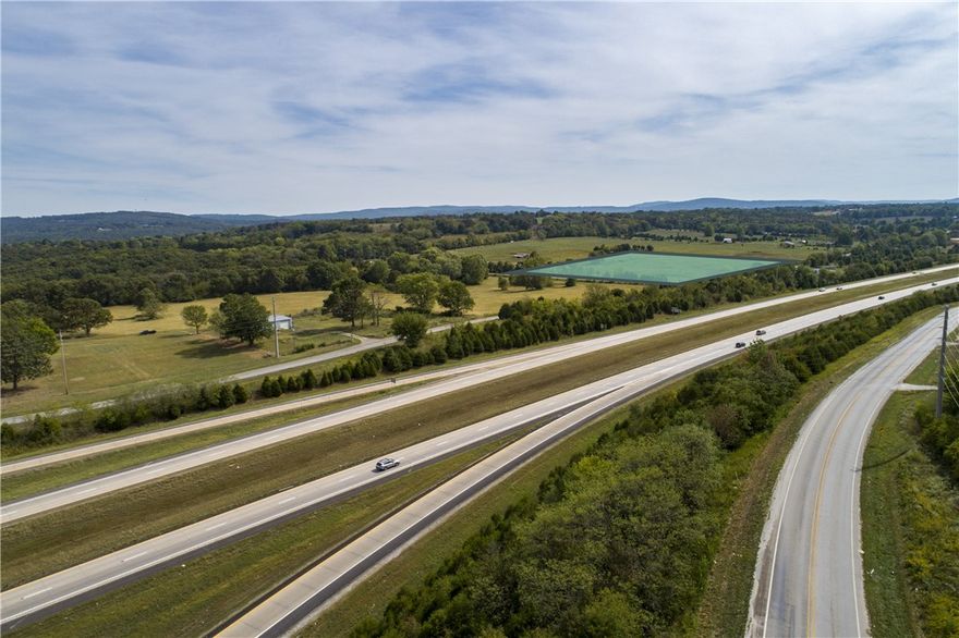 Zoning I-1 Light Industrial; 43 minutes to Bentonville; 55 minutes to Fort Smith; Septic system required; Additional Acreage Available