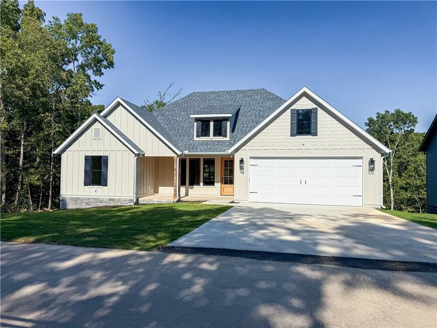 Discover the perfect mix of charm and function in this 3-bedroom + office, 2-bath cottage-style home set on a wooded 0.39-acre lot. Inside, enjoy custom cabinetry, ceramic tile, wood floors, and cozy carpeted bedrooms, all designed for comfort and everyday living. A secluded deck overlooks the trees, creating a peaceful backdrop for relaxing mornings or winding down in the evenings.

Here, recreation and convenience are just minutes away:
-Highlands Golf Course within 3 minutes
-Lake Loch Lomond only 5 minutes for boating and fishing
-Tanyard Creek Trail less than 10 minutes for hiking and waterfalls
- Walmart and shopping nearby for all your essentials