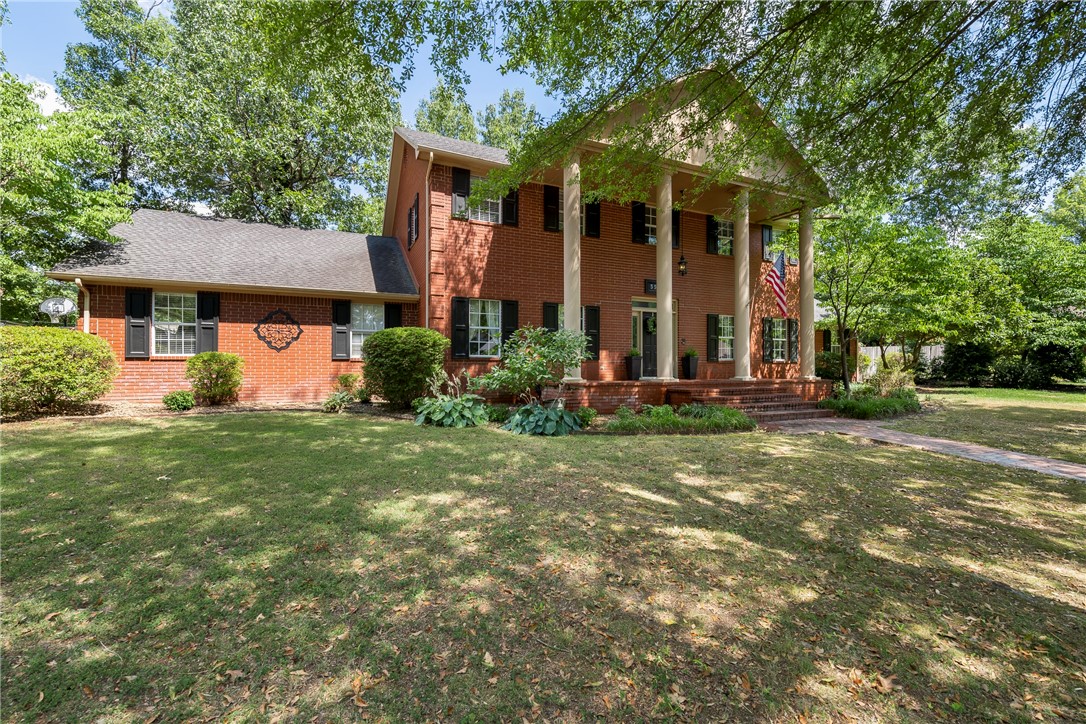 Beautiful Colonial home full of southern charm is located in very desirable neighborhood. This two-story home has two oversized master suites on each level. Large kitchen with double ovens and walk-in pantry with ice machine and drink refrigerator. Charming sunroom with brick flooring looking out to the in-ground pool. All bathrooms have granite countertops and closets are all large walk-ins with custom built-ins. Garage is oversized with additional room above it to use for storage, office or the perfect home gym. Close to SCC, and Lake Fayetteville.