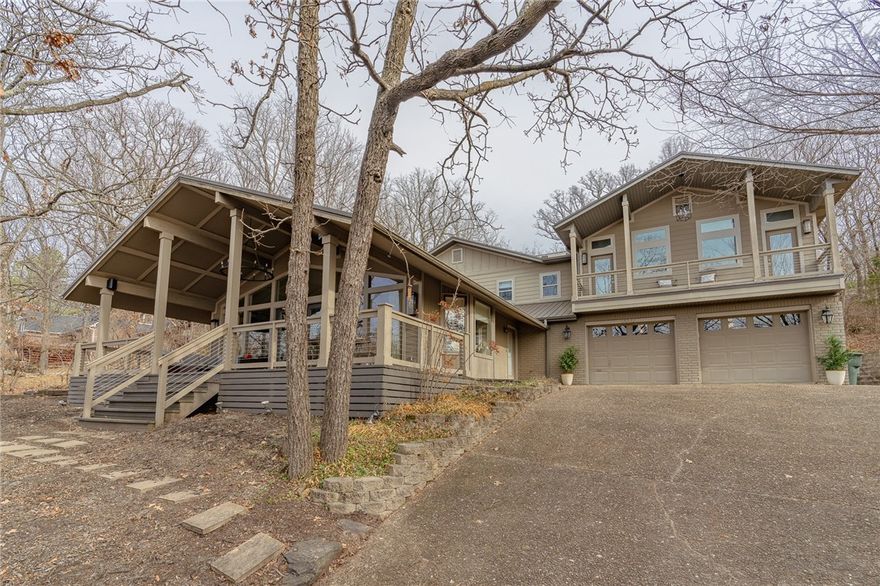 Centrally located amongst the trees of Township Hill, this modern Fayetteville home has been completely updated and features an open concept floor plan with a Westward facing floor to ceiling wall of windows that makes for amazing sunset views. The property has 4 bedrooms + office, 4 full baths, 2 laundry rooms and 3 covered/screened decks.  The owner’s suite has a laundry room, steam shower, soaking tub and ~200sf closet.  Additional downstairs en suite bedroom has a clawfoot tub and large walk-in closet.  Wolf range/oven, 14’ kitchen island with soapstone counters, coffee/wine dry bar, walk-in pantry and 2-zone surround sound makes this home an entertainer’s dream.  Fun fact – the home was previously owned by Seinfeld’s Prop Master.