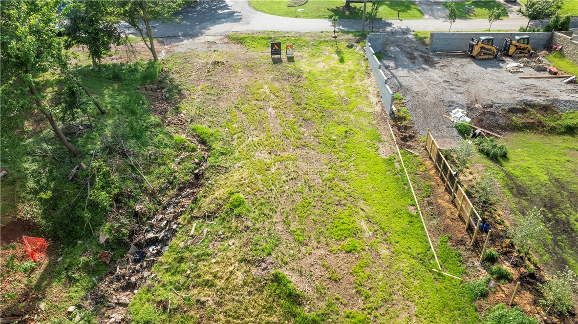 Overlooking and adjacent to Slaughter Pen Trail system and the new Greenway Flyover bridge, this is an amazing spot to build your next home. With a location that's walkable and bikeable to all things Downtown Bentonville, you'll get to experience Crystal Bridges Museum, Downtown Farmer's Market, Compton Gardens, local mountain and gravel bike trails, and all the best local restaurants and coffee shops.