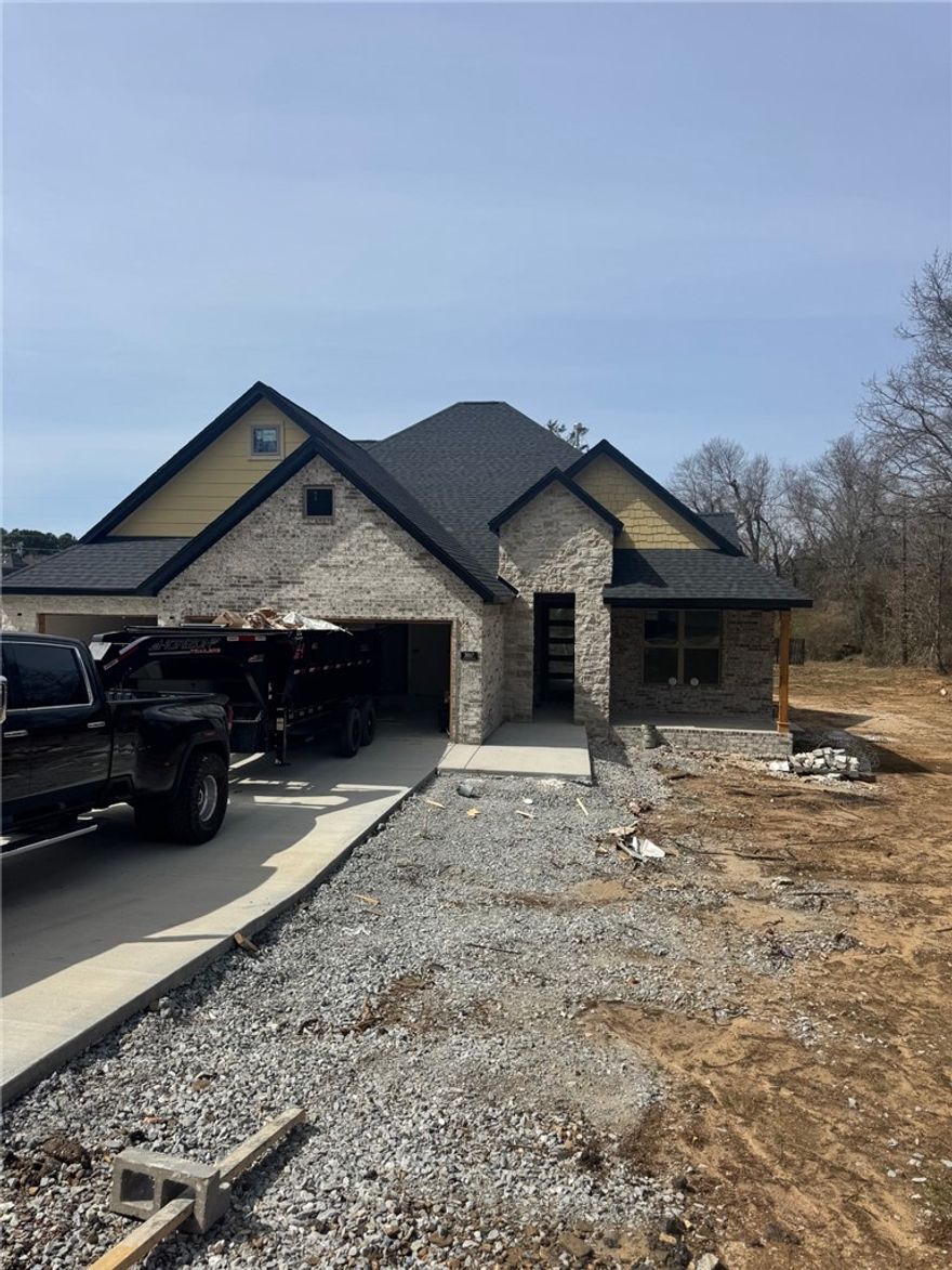 Fabulous new build in established east Fayetteville neighborhood.  4 bedrooms, 3.5 baths with wide open spaces.  2 bedrooms and bathroom upstairs, master and 1 bedroom or office/study downstairs, large pantry, large master closet that connects to laundry room, open kitchen into living area, big back patio with fireplace, built ins in living room.  Beautiful finishes.