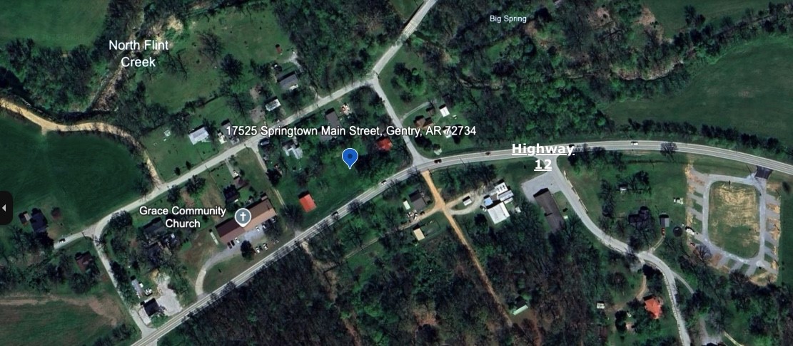 360' of highway frontage. The property is currently being used as a rental, and has endless business opportunities. Public water and gas available, 2 septics on the property, and a 3 bay storage building with electrical. Don't miss out on this opportunity to own 1 acre in the up and coming Springtown! Also listed as residential MLS 1300199