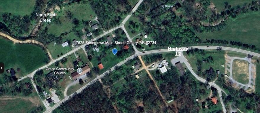 360' of highway frontage. The property is currently being used as a rental, and has endless business opportunities. Public water and gas available, 2 septics on the property, and a 3 bay storage building with electrical. Don't miss out on this opportunity to own 1 acre in the up and coming Springtown! Also listed as residential MLS 1300199