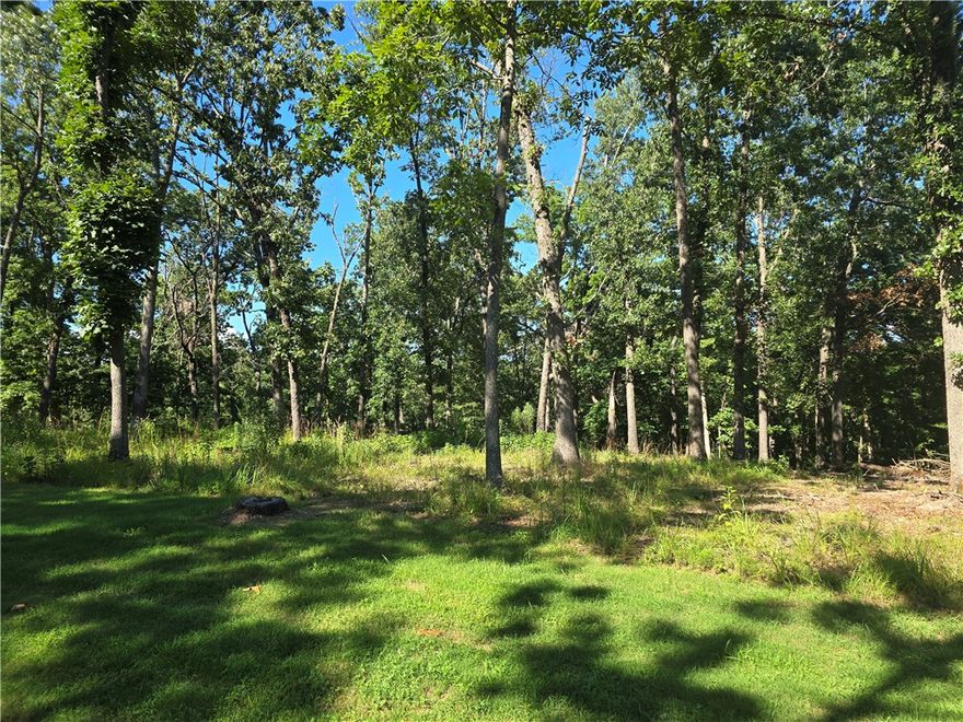 Perfect opportunity to build your dream home on this +/- 2.40-acre wooded residential lot, located just 5 miles from the Beaver Lake Boat Ramp and Lakeshore. Tucked away in a secluded, peaceful setting, this property offers a quiet rural lifestyle with convenient access to town. Electric is already available on-site, while a water well and septic system will be needed. With County Zoning, the current site plan is
preliminary and can be tailored to suit your needs in both size and shape, offering flexibility for your ideal build. Esculapia Hollow Rd is currently a dirt road, however, it is set to be paved this summer. Ideally situated approx. 3.5 miles from Lake Atlanta, 4 miles from Downtown Rogers, and 6 miles from Horseshoe Bend Marina, this lot provides the best of both worlds - tranquil living with easy access to outdoor recreation, shopping, dining, and more. Don't miss out on this prime piece of Northwest Arkansas real estate!