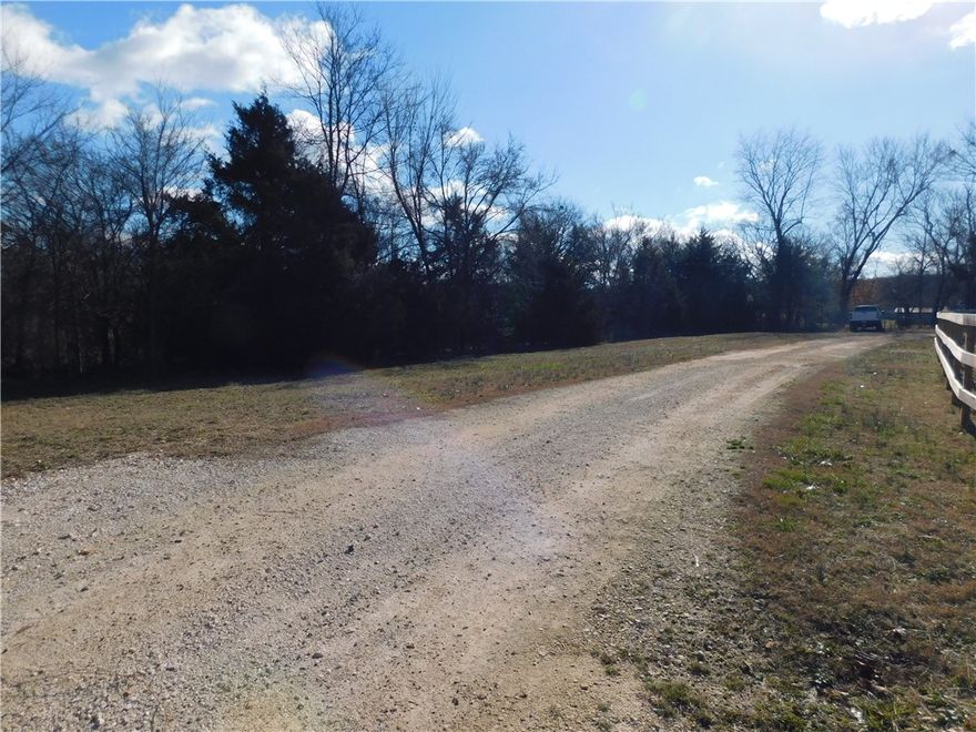 Level 1.00 Acre lot, partially wooded around an old homesite, black top road frontage, electric, public water bordering property. Private building site, views of the mountains, park like setting, gorgeous sunsets and starry skies. 8 minutes to highly rated Elkins schools. 10 min to shopping, doctors, restaurants. The great outdoors at its best yet close to town for all the essentials. Easy access to Washington regional Hospital approx. 30min! Straight shot (20 min) to the University of Arkansas, Fayetteville. Subject to lot split completion.  Agent Owned.