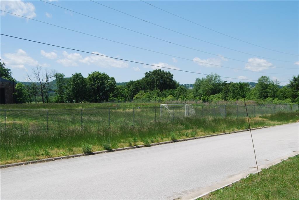 Vacant lot with 1 brick structure that is unused. Lot is fenced and has been used as outdoor soccer field by church league. Ready for your new business or hold for future development.
