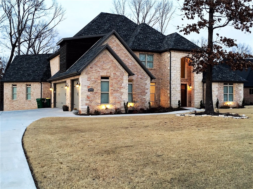 Natural Beauty on 1.8 acres in Versailles subdivision. This custom home features 2 living areas, wood floors, master and 2nd bedroom suite on main level, 3 bedroom and bonus up with upper and lower covered patios.