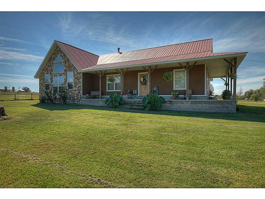 6 ponds, dairy barn, horse barn 2/tack & bathroom, hay barn, 2 chicken houses (1 operational), 1 bed cabin, all with electric and water, shop wired with 220, gen purpose barn w/elect, corrals w/ head chute, pole barn, Hay barn w/elec, holds over 400 bales,Rodeo arena w/7 lights, press box, running/roping chutes, pavilion, pond with waterfall, garage attic is floored with stairs, covered patio behind garage. Wood burning wood stove does not convey.