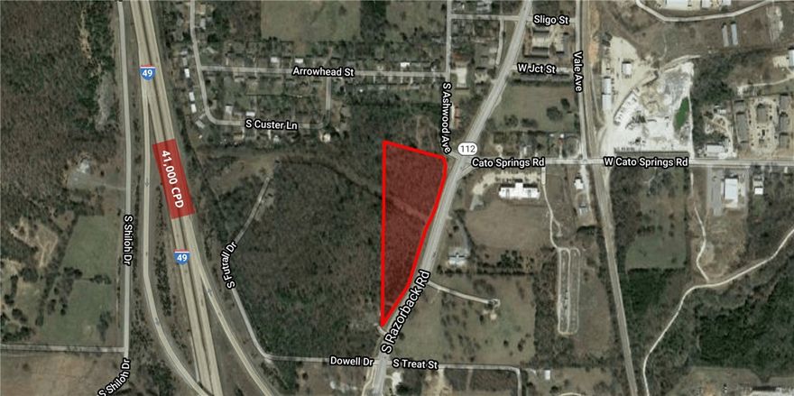 6 Acres located in a prime real estate development area. On the west side of Razorback Rd. Just minutes to MLK Jr. Blvd and the University of Arkansas. Easy access to & from I-49. Perfect for multi-family or student housing. Zoning is Neighborhood Services-Limited. Water is across the street, sewer at the intersection of Razorback & Cato Springs Road. Will subdivide.