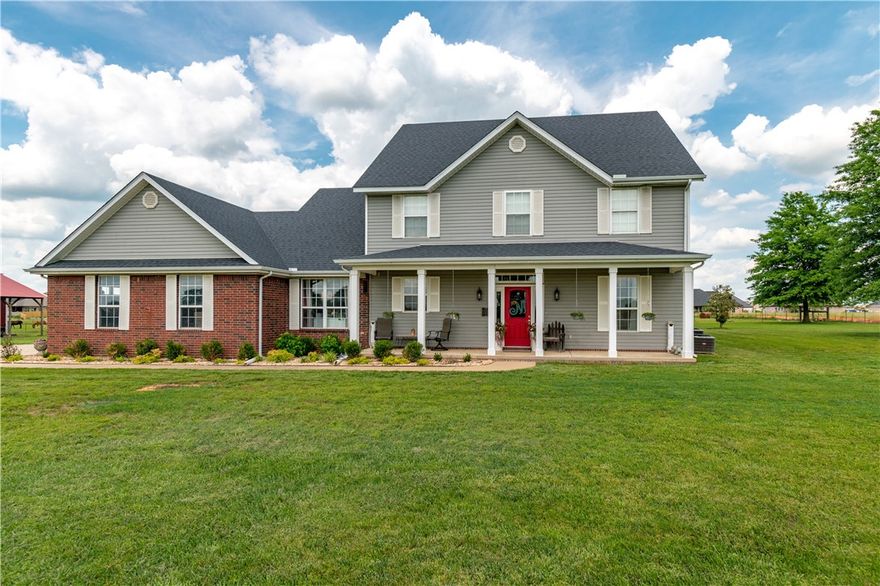 You will be impressed with this little bit of heaven.  Lovely farmhouse style home that boasts, 4 bedrooms, 2.5 baths, just under 5 acres of fenced property.  This home is centrally located in Tontitown, easy access to I-49 for easy commuting to anywhere in NWA. Fabulous outdoor entertainment area, with covered fire pit, cool decking all around.  Everything is set up for you to have horses, including pole barn and riding area. Covered RV area too.  This beautiful home has abundant natural lighting, crown molding, cathedral ceiling in the living room, and cozy gas fireplace.  Formal dining room with custom built-in cabinets, kitchen includes central island, walk-in pantry, stainless steel appliances, and breakfast nook. Main level master suite, garden tub, walk-in closet.  Second level bonus room and so much more!