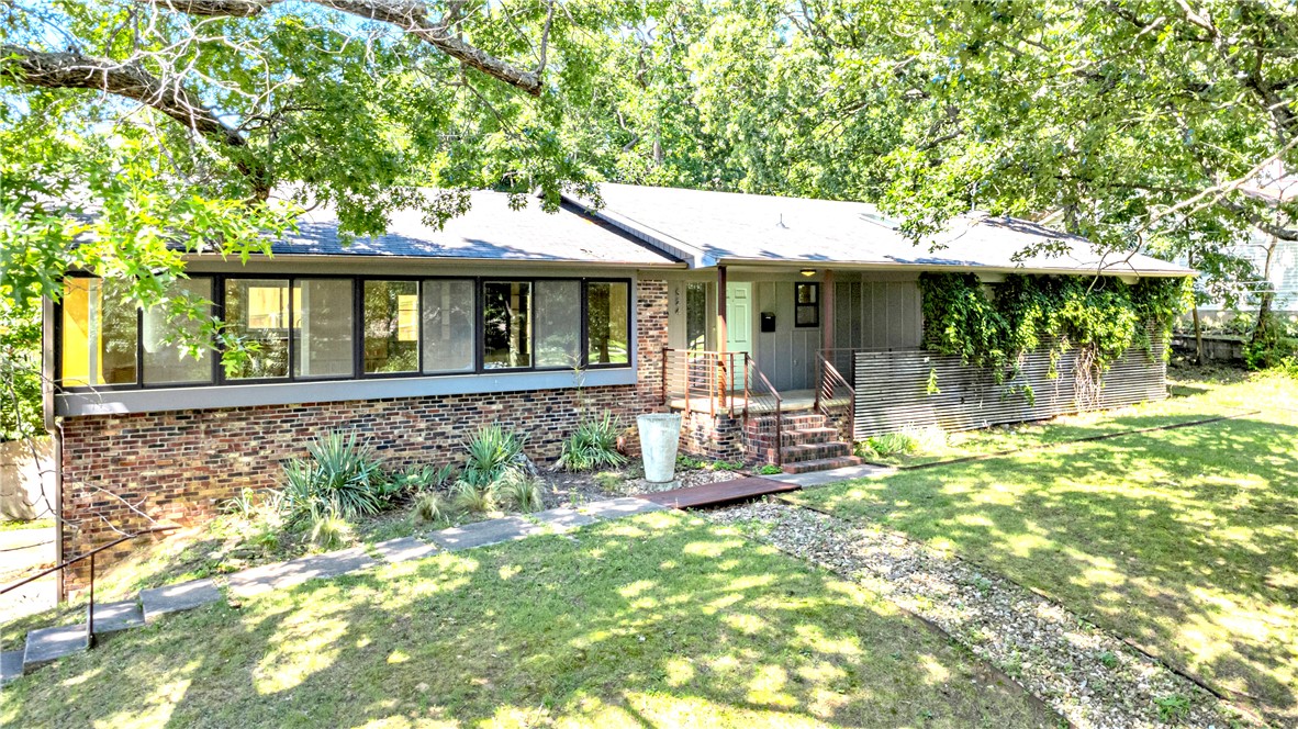 Step right over from Wilson Park to 524 W Prospect, a quintessentially Fayetteville funky home designed & remodeled by the renowned Modus Studios in an authentic mid-century modern style. This striking home radiates character, perfectly embodying Fayetteville’s eclectic and vibrant spirit. Situated right on Wilson Park, you’ll enjoy walking mere steps to the city’s favorite community green space. Whether walking to the swimming pool or playing a game of pickle ball, you are truly in the middle of it all. Step inside the home to find clean lines, thoughtful finishes, & stylish updates: warm wood accents, sleek built-ins, & natural light pour in, creating an inviting and energizing space. The large basement is an unexpected bonus – ideal for storage, a workshop, hobbies, or your next creative project. Don’t miss this opportunity to own a truly unique and special home in a prime Fayetteville location. Embrace the design, the vibes, and the unbeatable access to everything that makes this city so special. Owner/Agent.