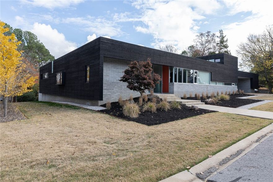 UNBELIEVABLE property on Mt. Sequoyah-architecturally designed by Marlon Blackwell. "One of a kind" home in the flair of Frank Lloyd Wright. This contemporary house boasts an exquisite design, with sleek lines and modern finishes that create an atmosphere of sophistication and luxury. One-level home with loft area! Should be called "House of Light" with large windows that let in plenty of natural sunlight and create bright and airy spaces. The open floor plan and high ceilings enhance the sense of spaciousness. Chef's Kitchen with island opens to Living Room and Formal Dining Room. Fabulous home for entertaining! Other features include granite countertops, can lighting throughout, a carport and HUGE 41' x 26' deck with a built-in hot tub, and a private backyard on a corner lot. Discover a new level of modern living with this stunning house that seamlessly blends style, comfort, and luxury. Don't miss the opportunity to make this exquisite property your dream home.