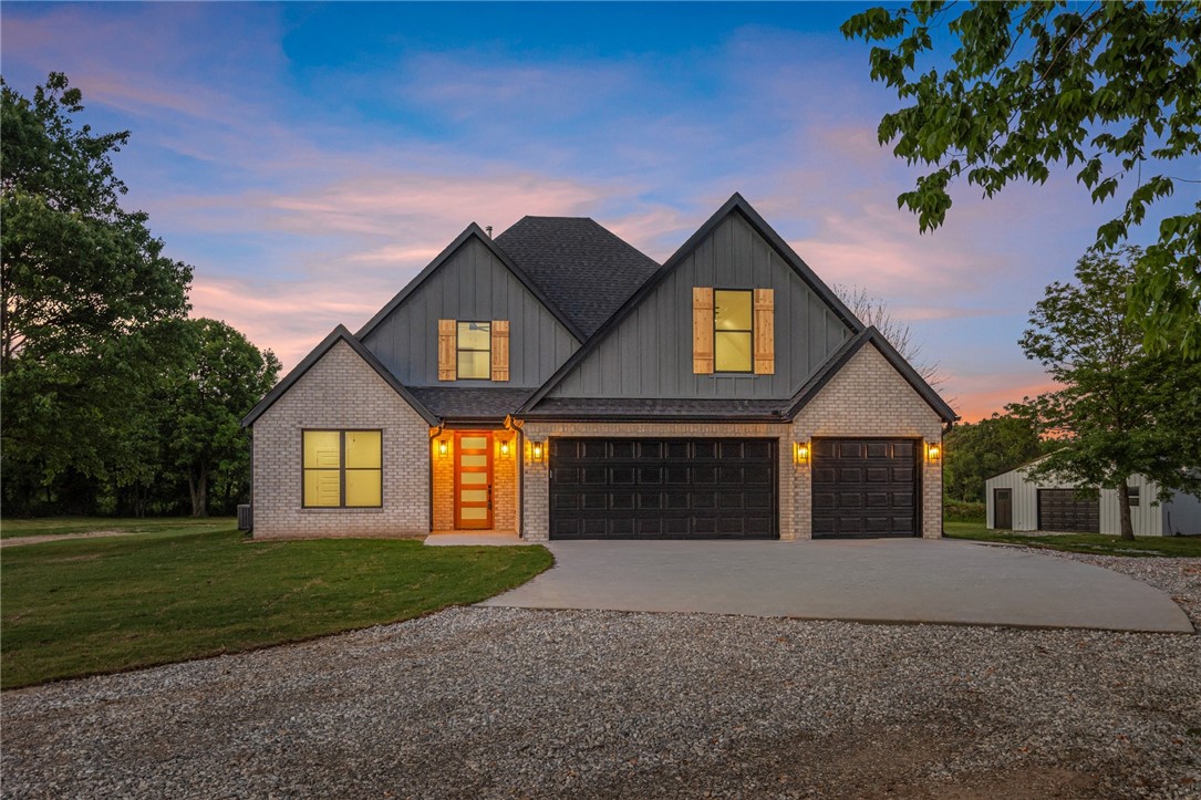 New construction home on 1.34AC, offering private setting w/out covenants. Builder upgrades throughout the 4-bed home. 3 car garage & a 900 SF shop - a rare find just 15 minutes away from Downtown Bentonville and in Bentonville School District. Foyer entry w/guest bed & guest bath on left. Wood flooring throughout home. Spacious open living area has tons of natural light & overlooks your private backyard w/ wooded views & large open yard space. The living room boasts vaulted ceilings & gas fireplace. Kitchen features quartz countertops, large island, gas cooktop, great working layout & pantry. Dining space off the kitchen. Primary suite w/private access to backyard & attached bath that connects to laundry. Primary bath has a walk-in shower with designer tile and built in shelving, soaking tub, and dual vanity areas. The walk-in closet dual built in dressers. Large laundry has wash sink & built in storage bays. Upstairs is a large bonus room & 2 guest beds plus guest bath.