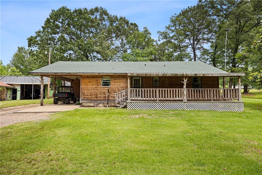 Are you looking for a home on the lake, then don't miss seeing this one! This 3 bedroom country style home sits on 2 tree covered acres directly across N Shore Road fronting Lake Atkins. Enjoy the direct lake view from the comfort of your front porch and unwind! Large detached shop building with ample storage room complete with a true man-cave (footage not included in living space from house). New roof installed May 2025. Come and see!