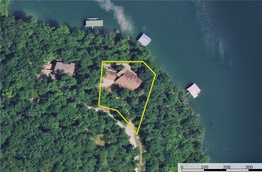 Gorgeous log home on Beaver Lake in Eureka Springs, AR. This 6,100 sqft hidden paradise sits on 1.54 acres with over 200 feet of lake frontage. Perfect for corporate retreats or vacation home, has 5 bedrooms, 3.5 bathrooms, granite countertops, billiards/ping pong room, movie room, wet bar, 2 slip private boat dock with 2 lifts, and swim deck. Absolutely beautifully detailed wood finishes throughout. Perfect for entertaining or taking in the beautiful beaver lake views from 1 of 2 very large scenic decks. Kitchen and all bathrooms have been updated with commercial grade stainless appliances within the last 3 years.  The deck railings, water heater, washer/dryer have also been replaced in the last 3 years. Entire home has recently been stripped and stained. Home being sold FULLY FURNISHED. Sellers have previously rented as an AIRBNB/VRBO for $950 per night! Located just minutes from Eureka Springs shopping, dinning and live music. Don't miss out on this amazing home. Call to day for a private tour.