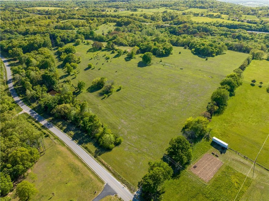 Check out this 90 acres of rolling hills 8/10 minutes outside of Fayetteville. This property is ideally located and provides the seclusion and serenity for country living, Property is cleared with rolling hills and surrounded by wooded throughout , 3 ponds with water, utilities at the street. This a a one of a kind piece of property with natural springs, rock cliff scenery which happens to sit in one of the more convenient locations. Also listed as MLS # 1240423.