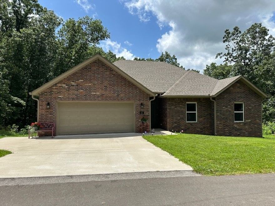 This home is just shy of brand new! Built in 2022. Very well maintained, a clean canvas for your artistic flare to shine inside and out! No undoing to redo! Split floor plan, 10' ceilings, large master bedroom en-suite, tray ceiling and walk-in/thru closet that leads into the laundry room! Soft-close cab/drawers. Leaf filter guttering system for easy maintenance.  Spacious garage, Great locaton! Peaceful & Calm. Natural setting w/wildlife, lots of trees & blackberries. Lot to the west offered for sale by this owner for a shop or addt'l privacy.  Several surrounding lots owned by one neighbor to maintain privacy in that cul-de-sac.  Propane tank conveys w/sale affording freedom to shop propane prices. TV mounts, custom curtains convey. Refrigerator & washer/dryer negotiable.  Less than 1 mile to Tiree Park & Boat Launch ramp at Lake Loch Lomond, 4.6 mi to Branchwood Clubhouse, approx 2.5 miles to I49 on/off ramps at Centerton and approx 3 miles to the Highlands I49 on/off ramp.  Easy commutes!!