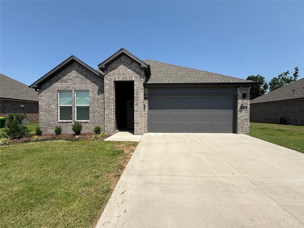 In a quaint neighborhood just minutes to the U of A and I-49, this brick 4-bedroom, 2-bath home is perfect for both everyday living and entertaining. This bright and open floor plan seamlessly connects the living room, dining room and kitchen. The kitchen is equipped with a large island, quartz countertops, stainless steel appliances and a spacious walk-in pantry, offering plenty of storage. Throughout the home, you'll find luxury vinyl plank flooring that adds style and durability. The primary bedroom includes an ensuite bathroom with quartz countertops, double sinks, an oversized shower and a generous walk-in closet. The additional 3 bedrooms feature ceiling fans as well as spacious walk-in closets. Come see this beautiful home for yourself and experience the perfect blend of luxury, comfort, and convenience in this friendly community! Its move-in ready and waiting for you!