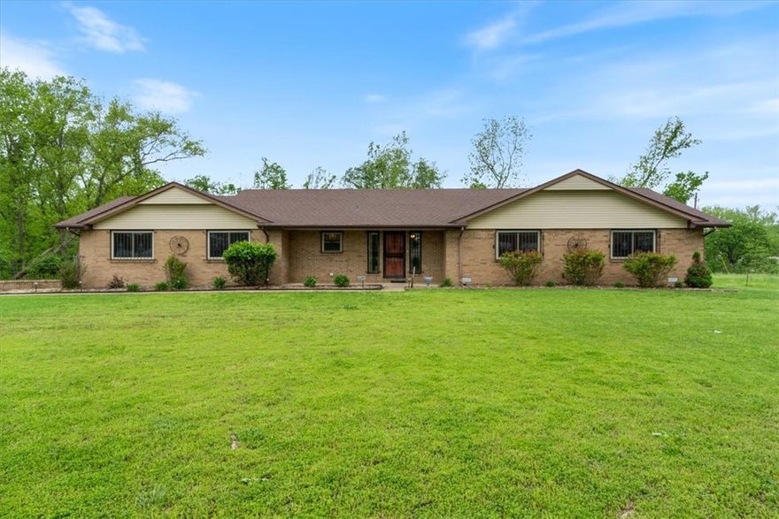 If you’re looking for peace, space, and a place to put down some roots, this all-brick ranch in Little Flock might be just the ticket. Built like a bomb shelter and sitting pretty on 5.99 acres, this 3 bed, 2 bath, oversized 2-car garage home has oversized bedrooms, generous closets, and solid bones ready for your personal touch.

The land is fenced and cross-fenced—perfect for horses—with a 3-stall barn (water access included), a tack room, and extra outbuildings for all your tools and toys. There’s even a dedicated RV shelter with a concrete pad and power, whether you're storing the rig or throwing a good ol’ country gathering.

Inside, you’ll find a cozy cast iron fireplace insert, a sunroom to soak in the view, and a separate hot tub room for winding down. It’s got charm, but it’s due for a full cosmetic overhaul—which is why the sellers are sweetening the deal with a $50,000 renovation allowance WAC.

Home is pre-inspected, roof in '20 & HVAC in '22. Complete due diligence folder available upon request.