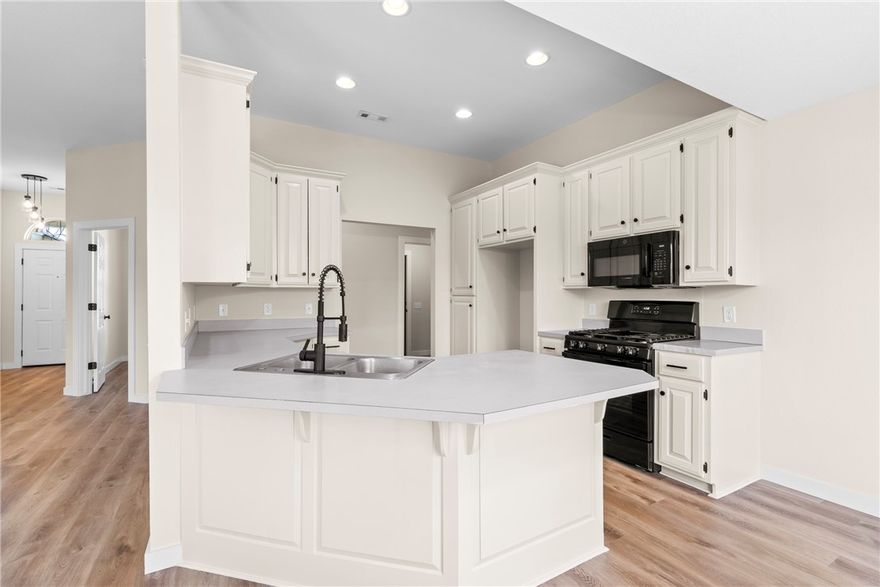 Completely updated and move-in ready, this 3-bedroom, 2-bath home with a dedicated office offers refreshed living in Fayetteville’s desirable Mount Comfort area. Renovations include new LVP flooring, fresh interior paint, updated trim, and new plumbing fixtures. The updated kitchen features new appliances, painted cabinetry, and lighting, opening to the main living and dining areas—ideal for everyday living and entertaining. The living room offers a cozy fireplace and ceiling fan. The primary suite includes an updated bathroom, while two additional bedrooms and a separate office provide flexible living space. Major upgrades include a newer roof and HVAC system. Outside, enjoy a new deck, groomed mature trees, and a private backyard. Located one block from Halcomb Elementary School and across from Clabber Creek Trail (future Razorback Greenway connection), with quick access to shopping, dining, and Northwest Arkansas amenities. Seller to offer $10,000.00 buyer concession at closing with accepted offer.