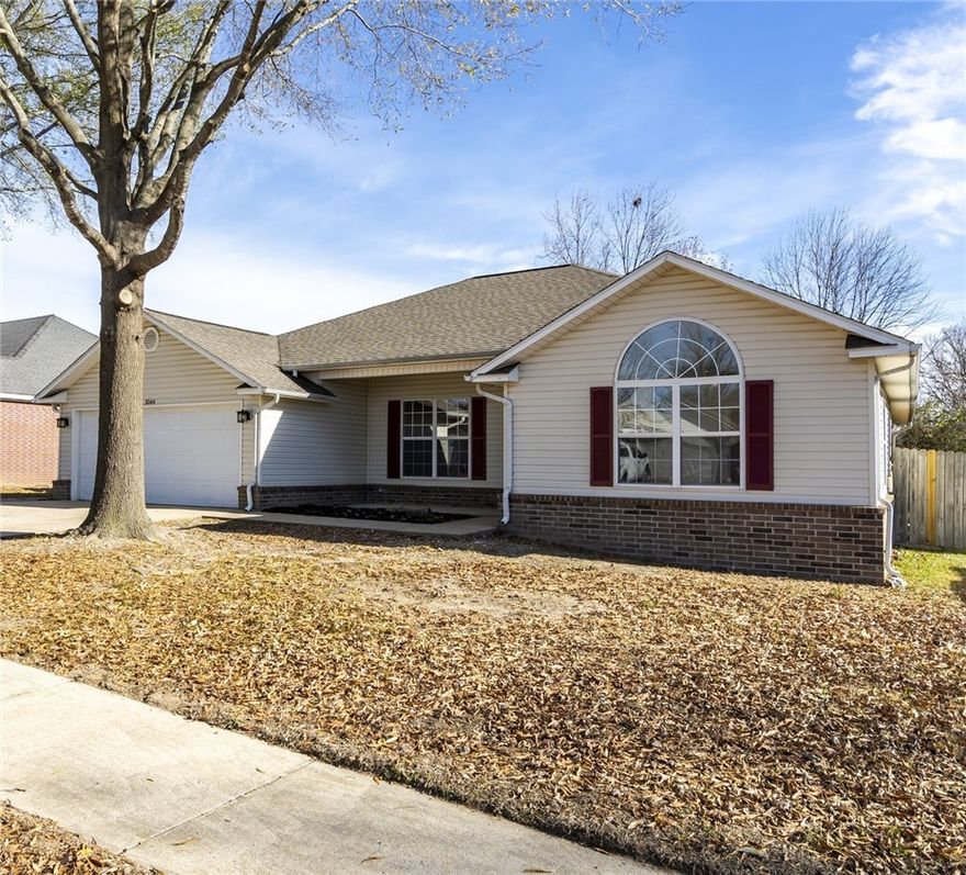 Completely updated and move-in ready, this 3-bedroom, 2-bath home with a dedicated office offers refreshed living in Fayetteville’s desirable Mount Comfort area. Renovations include new LVP flooring, fresh interior paint, updated trim, and new plumbing fixtures. The updated kitchen features new appliances, painted cabinetry, and lighting, opening to the main living and dining areas—ideal for everyday living and entertaining. The living room offers a cozy fireplace and ceiling fan. The primary suite includes an updated bathroom, while two additional bedrooms and a separate office provide flexible living space. Major upgrades include a newer roof and HVAC system. Outside, enjoy a new deck, groomed mature trees, and a private backyard. Located one block from Halcomb Elementary School and across from Clabber Creek Trail (future Razorback Greenway connection), with quick access to shopping, dining, and Northwest Arkansas amenities. Seller to offer $10,000.00 buyer concession at closing with accepted offer.