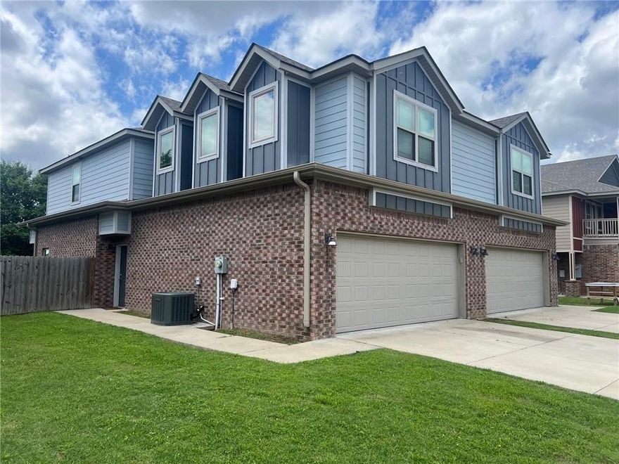 Live in style with three upstairs bedrooms, each featuring a private full bath and walk-in closet, plus a convenient half bath on the main level for guests. The open-concept main floor is perfect for everyday living, with covered second-story balcony for relaxing outdoors. Entertain with ease in the fenced backyard and spacious patio, and enjoy the convenience and security of a two-car garage. Located just minutes from I-49 and the University of Arkansas, this townhome offers comfort, style, and convenience. Available August 1st, 2026, but you can reserve it today!