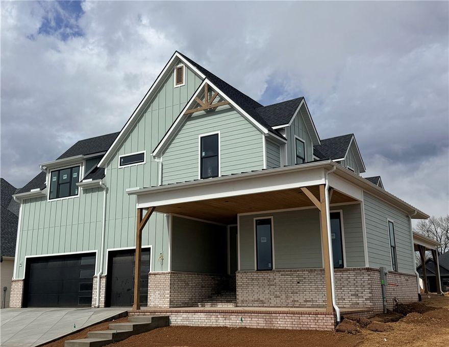 Experience refined living in this beautifully designed Laney Floorplan in the Aurora community, where thoughtful design meets everyday luxury. The main level features an open-concept living, kitchen, and dining space that flows seamlessly into a covered outdoor patio. A private owner’s suite offers a peaceful retreat with a spa-inspired bath and spacious walk-in closet, while a dedicated office, drop zone, pantry, and laundry area add convenience to daily living. The layout also includes a separate game or guest suite on the main level for added flexibility. Upstairs, additional bedrooms and bathrooms are complemented by a versatile bonus room ideal for a media space or second living area. With a spacious three-car garage and well-appointed indoor and outdoor spaces, this home offers a sophisticated living experience in one of Bentonville’s most desirable communities.