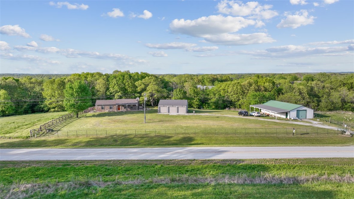2496sq.ft. 3bed 2bath home with lots of garage and a 30x60 SHOP on 20 acres that's Centrally located just 6 minutes from table rock boat launch, 26 minutes to Johnny Morris' PGA Golf Courses. Close to Branson, MO, 16 minutes to port of Kimberling. 3 car garage. Finished basement. Upgraded kitchen with custom cabinets and stainless appliances. Highway frontage. Fenced for animals or Horses.