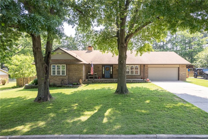 This gorgeous ranch-style home offers space, style, & updates throughout. The original full remodel was completed in 2016 with a new HVAC System & deck added in 2019. A brand-new roof, freshly stained and sealed deck, & new paint throughout add to its move-in-ready appeal  Inside, enjoy granite countertops, stainless steel appliances (approx 3 years old), & updated bathrooms featuring stunning floor-to-ceiling tile. The living area centers around a beautiful wood-burning stone fireplace. The home lives large with spacious rooms and includes a private mother-in-law suite or guest accommodations with its own bathroom—perfect for visitors or multi-generational living. Step outside to a large, landscaped backyard ideal for entertaining on the expansive deck & covered patio. Yard also features a dog run & dog door, thoughtfully designed with four-legged friends in mind.