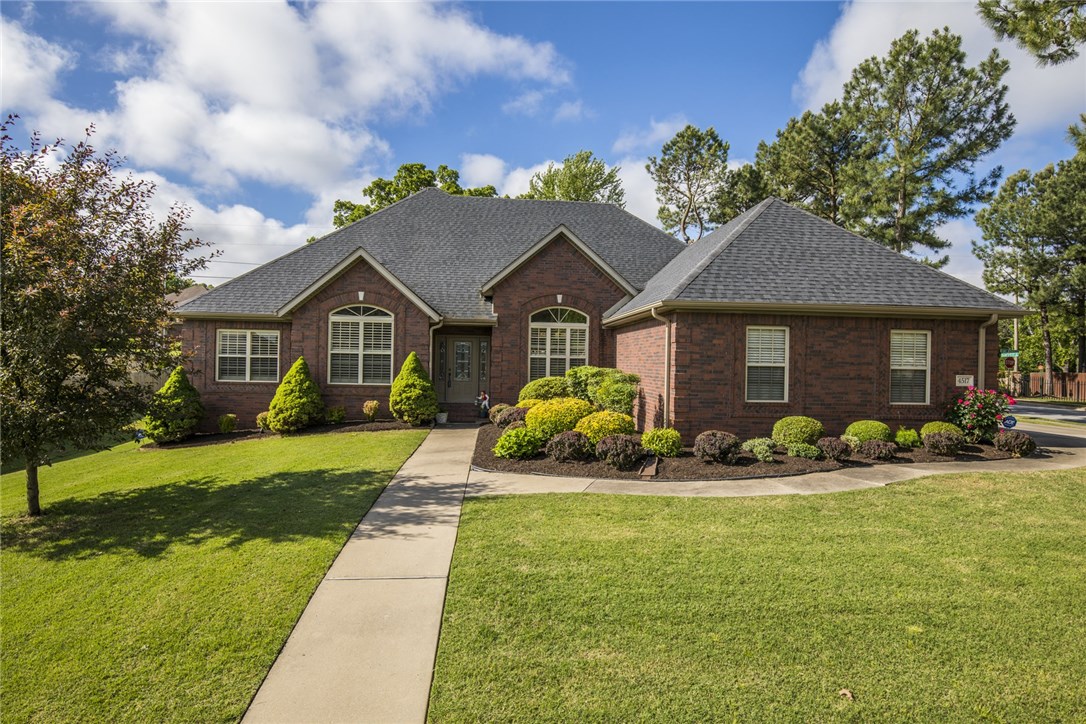Stunning Pinewoods home boasts plantation shutters, granite counter tops, new roof in 2017, new master shower, updated appliances and fixtures! 3 bedrooms with office or 4 bedrooms, 2.5 baths, formal dining room, 3 car (side load that will actually will hold 3 cars) garage, professionally landscaped, covered back patio, irrigation, & fenced back yard. Subdivision has community pool, basketball court, pond, and backs up to trails. Close to schools, restaurants, and Walmat Super Center! Refrigerator, washer, & dryer convey!