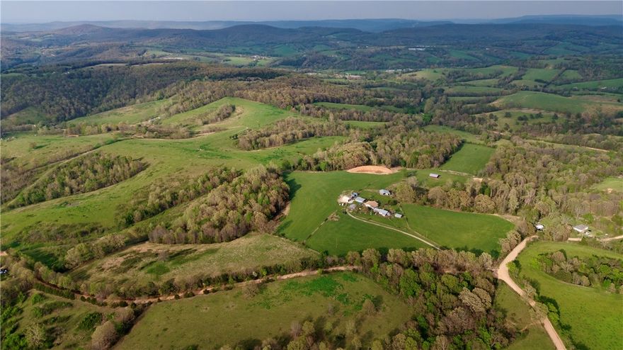 The perfect blend of beauty and functionality awaits with this exceptional 47 +/- acre tract in Carroll County. This premium combo property features a healthy mix of pasture and mature timber! Perched high on a scenic hilltop, it offers breathtaking panoramic views. Enjoy sunrises with your morning coffee or peaceful sunsets in this picture-perfect setting. Multiple cleared areas provide options for a private estate, family compound, hobby farm, or expanding your current operation. Electricity is already on site, helping streamline future improvements. Ample county road frontage ensures easy access. Outdoorsmen will appreciate the recreational appeal, while a newly constructed pond adds beauty and future fishing potential, or a watering source for wildlife or livestock. This eye-catching property is one you don’t want to miss!