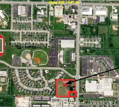 5.07(+/-) acres located in a prime location on SE J St across from the Bentonville High School. All city utilities available, currently zoned A-1, homes and outbuildings are of "no value". Great development potential.