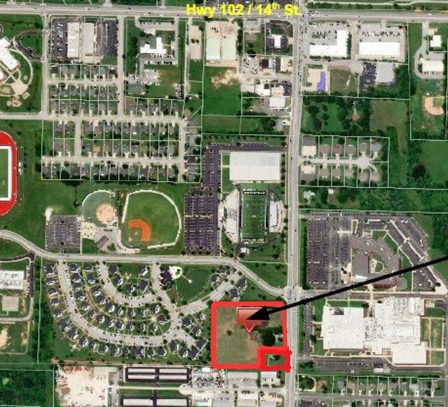 5.07(+/-) acres located in a prime location on SE J St across from the Bentonville High School. All city utilities available, currently zoned A-1, homes and outbuildings are of "no value". Great development potential.