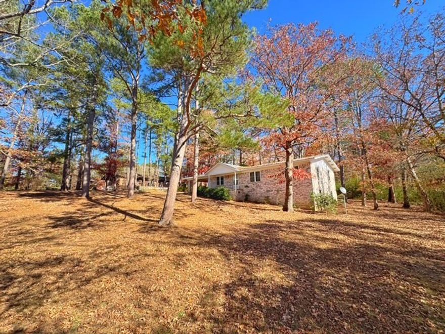 Welcome to 147 Memory Lane, A well maintained 3 bed, 2 bath home on 1.24 acres with all the extra space you’ve been looking for. With 1,484 sq ft on the main level plus a walk-out basement for additional storage, this one gives you room to breathe. The home features a metal roof, a cute covered front porch, and a large two car carport to keep you out of the weather. Inside, you’ll find a comfortable layout, a cozy wood-burning fireplace, and easy access to the outdoors. Need workspace? You’ll love the 468 sq ft detached shop, perfect for projects, hobbies, or extra storage. Property is on city water and sewer, giving you the convenience of town with the space of country living. A solid, well cared for home with land at an affordable price. Come see it in person and imagine the possibilities!