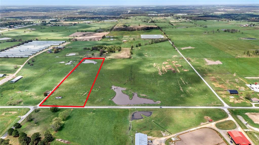 Blank canvas with great location! 10+/- clear, flat, land with pond. Looking to build your dream homestead? This location offers privacy while being minutes to everything in town. Located on Airport Road/Bill Young intersection this land is 1/2 mile off HWY 59 and just 2 miles to HWY 412. Easy commute to work, paved road, booming area. (additional land available)