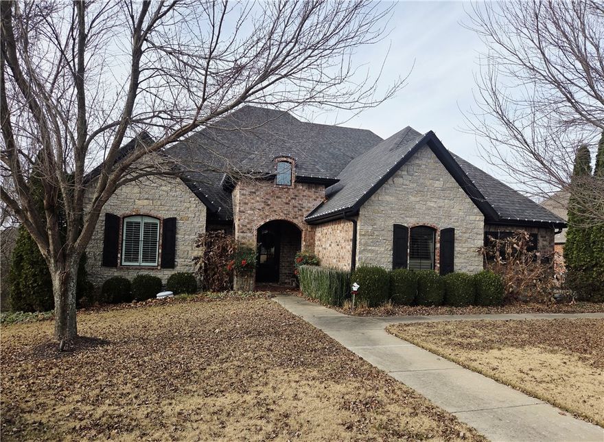 Situated just 15 minutes from both the UA campus and downtown, this impeccably maintained residence in Stone Mountain Estates offers an open floor plan with soaring ceilings, exposed beams, and a fireplace enhanced by a built-in bookcase. The expansive kitchen includes a substantial island, a five-burner gas range, pot filler, double ovens, and a walk-in pantry. The property comprises four bedrooms, three & a half bathrooms, an office, a formal dining room, and a bonus room, with three bedrooms located on the main level and one upstairs. Additional highlights include a three-car sideload garage, a deck with fireplace and picturesque wooded views, as well as a lower-level patio featuring a hot tub. The listing price encompasses all furnishings, accessories, refrigerator, washer, dryer, and hot tub. The furniture, purchased in 2022, remains in exceptional condition. The home was freshly painted in 2022 and recent updates feature new light fixtures, select carpeting, cabinet and door hardware, hinges, and appliances.