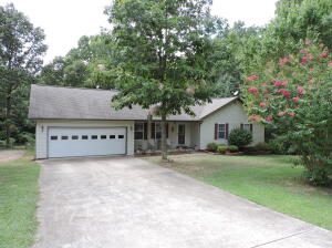 Located between Harrison, Ar and Branson, Mo, this beautiful 3 bedroom 2 bath brick and vinyl home sits on a tree shaded, 1 acre m/l lot. The large living room has vaulted ceilings and a gas fireplace. Remodeled kitchen has new countertops, backsplash, sink and faucets. This kitchen also contains a Pantry. Enjoy your meals in the spacious eat-in kitchen or dining room and relax in the comfort of a big master bedroom with walk-in closets and a new soaker tub in the master bath. There is crown molding detail throughout the house. Plenty of room for entertaining on the back deck and lots of privacy in the large back yard. There is a garden spot and 2 storage buildings, one with electricity and workshop. An easy drive to Table Rock Lake or Bull Shoals Lake!
