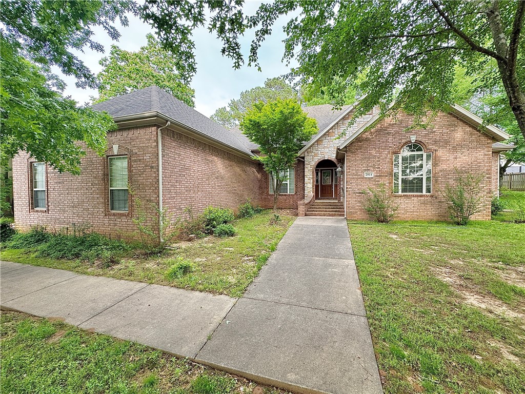 4 bedrooms and 3 full bathrooms. Extra nice executive home with split floor plan, separate dining room, breakfast bar, granite countertops, center island in kitchen, and 3 car garage. All kitchen appliances furnished including double oven, micro-vent hood, refrigerator, and cook top all in stainless steel. Family room has gorgeous fireplace with mantle and built in TV nook with doors, 13’’ Italian tile in all areas except bedrooms and living area with a beautiful cut berber in bedrooms and main living area. The large master suite has 2 large closets, a corner whirlpool tub, step-in shower, double sinks and much more. Master suite also has a private access to covered patio in back of home. 2’’ blinds, ceiling fans, large crown molding and upgraded lighting throughout. Nice laundry room with mud sink and built ins. Home is located at the Fayetteville Country Club with easy access to I-540.