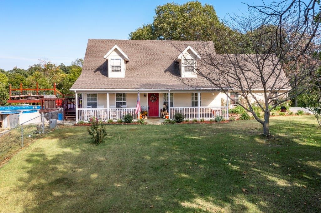 Beautiful Country Home on 2.89 aces. This home has it all, open floor plan w/vaulted ceiling, wood floors, large Eat-in Kitchen w/Island, newer appliance including granite farmhouse sink, 2 BDRMS on main floor and gas log fireplace. Upstairs you will enjoy your private Master suite w/ 2 closets, large open bathroom w/ plenty of counterspace, corner whirlpool tub & W/I shower. Catwalk leads to bonus room where you will pass perfect space for office/sitting area. Outside has so much to offer from the covered front porch to the back patio leading to large deck around above ground pool great for entertaining, to so much yard to run around on! Plenty of space for a large garden and few animals. Metal storage building w/electricity. New Roof 2017, New HVAC 2019, Nest Thermostat 2021, updated with newer appliances, light fixtures all new fans and faucets. Tree lined back yard gives you the privacy you want, all with the convenience of town just a short drive away!