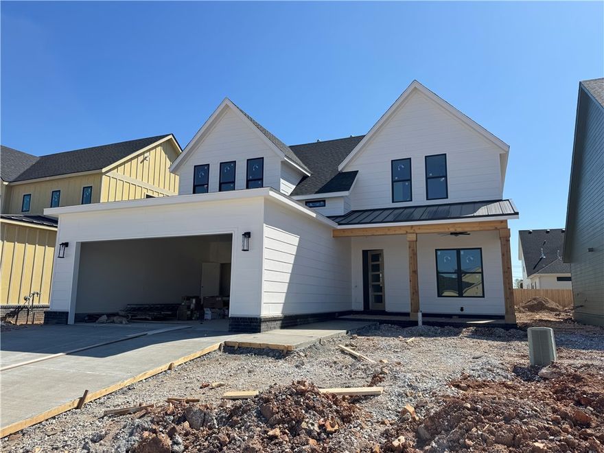 Welcome to Meadow Brook in SW Rogers! Great community in the best location! This plan features 3-4 bedrooms (2 flex spaces either bedroom 2 or study option as well as upstairs bedroom 4 or bonus room). All bedrooms have walk-in closets with plenty of storage! Downstairs you will find the primary bedroom. Great layout with open kitchen/living room area. Kitchen has large island to sit up to 6 bar stools, built-in gas cook top, built-in oven and microwave, large pantry, and eat in dining area. Primary bedroom feature en suite bathroom with soaking tub, walk-in shower, his and hers separate vanities, and large closet with lots of built-ins. Bedrooms 2,3 & 4/bonus room are upstairs along with a full bathroom. Enjoy the evenings grilling on the covered back patio! Can't beat location being only minutes to shopping, dining, groceries stores, and only steps to the Razorback Greenway Trail.