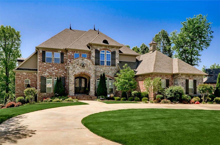 Stunning Verucchi custom built home in N Springdale. Features: heated floors in mstr BA. Lower level has complete kitchen, liv area, BR & BA. Lg living, form dining, kitchen, mstr suite & laundry on main level. Handscraped hardwood floors in main living areas, brick flooring in kitchen.  3 lg BR & 2 1/2 BA plus playroom upstairs. Sunroom & deck on main level overlooks backyard/pool area.