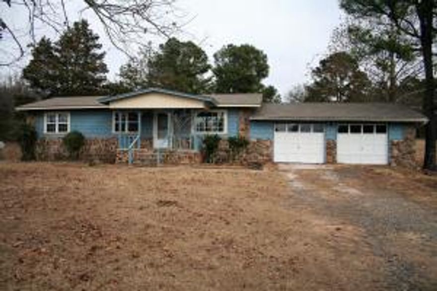 County home on 2.22 acres. This home offers 3 bedrooms and 1 bath. There is an extra room on the back of the house that is not included in the sq. footage,  but has a window air unit. Roof is less than 2 years old.