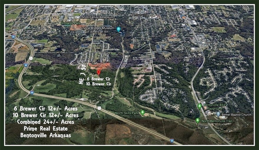 Prime location with tons of potential!  Close to Crystal Bridges Museum, Bentonville Square and the Slaughterpen biking/walking trails.  Property has over 500' of road frontage on "J" St. and joins 12 acre  MLS listing 1511353.  Single wide on property has no value.