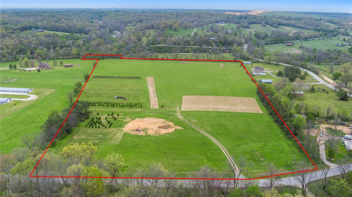 Discover a rare opportunity to own 26.45 beautiful acres located just minutes from the heart of Fayetteville. Nestled a short ways off Wheeler Rd on W Gun Club Road, this expansive property offers the perfect blend of privacy, natural beauty, and opportunity. With flat open meadows but surrounded by mature trees, the land is ideal for a variety of uses — whether you're dreaming of a private estate, a family farm, recreational retreat, or future development. The property boasts ample road frontage, easy access to utilities, and is just a short drive from I-49, the University of Arkansas, shopping, dining, and outdoor attractions. Properties of this size and location are increasingly rare in Fayetteville — don't miss your chance to invest in a piece of Northwest Arkansas' thriving future.
